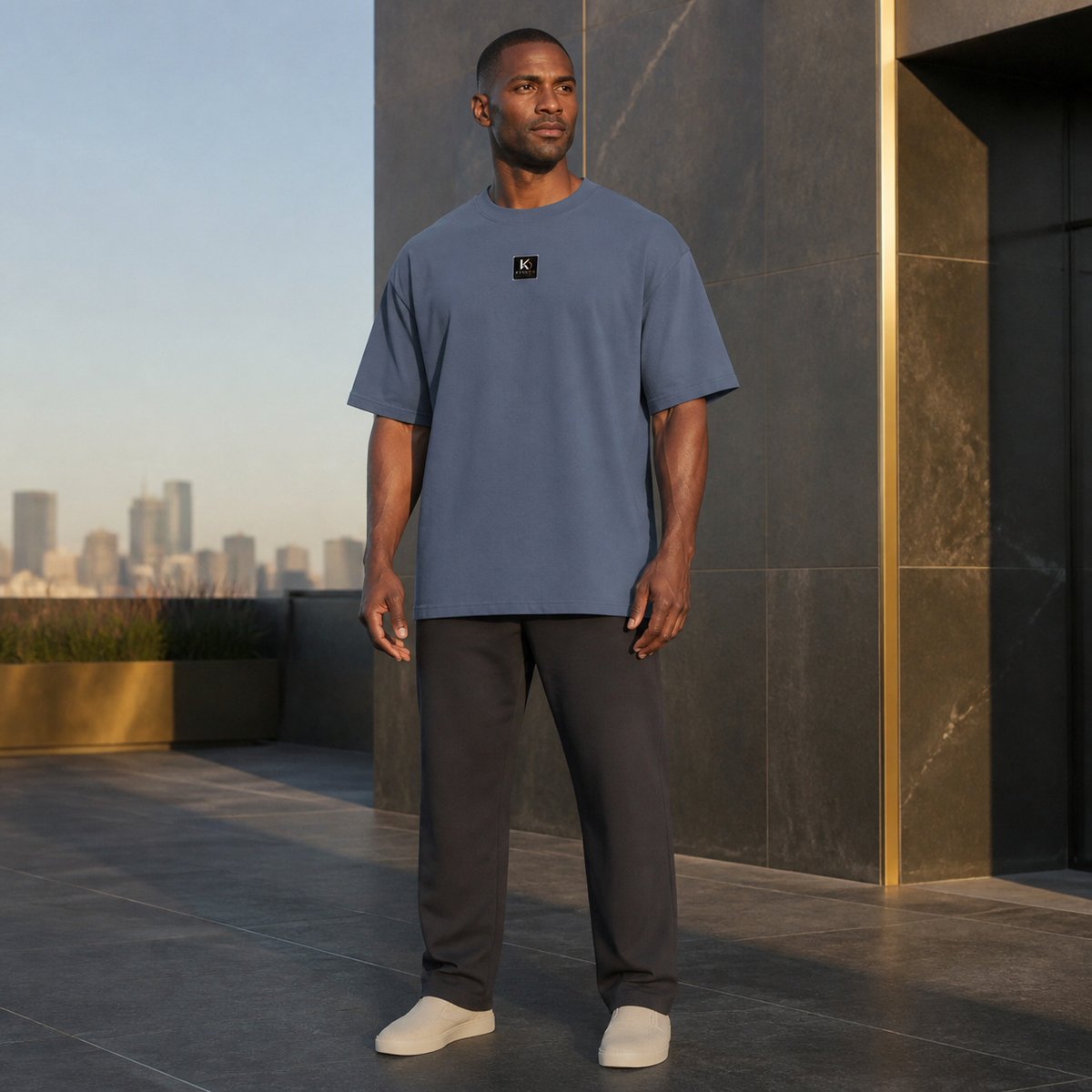 KYNDEO Fadeweight Oversized Tee in faded indigo, complete front lifestyle view on a Black male model