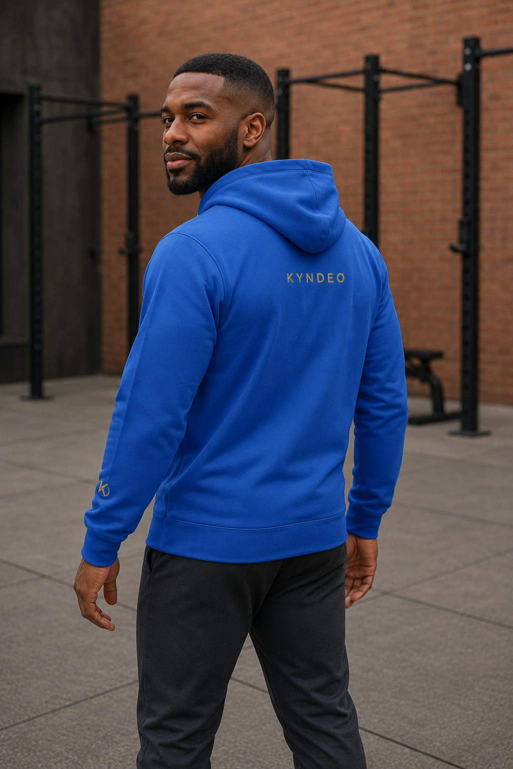 KYNDEO Forge Hoodie - Royal Signature in royal blue, rear three-quarter view showing the back and sleeve marks