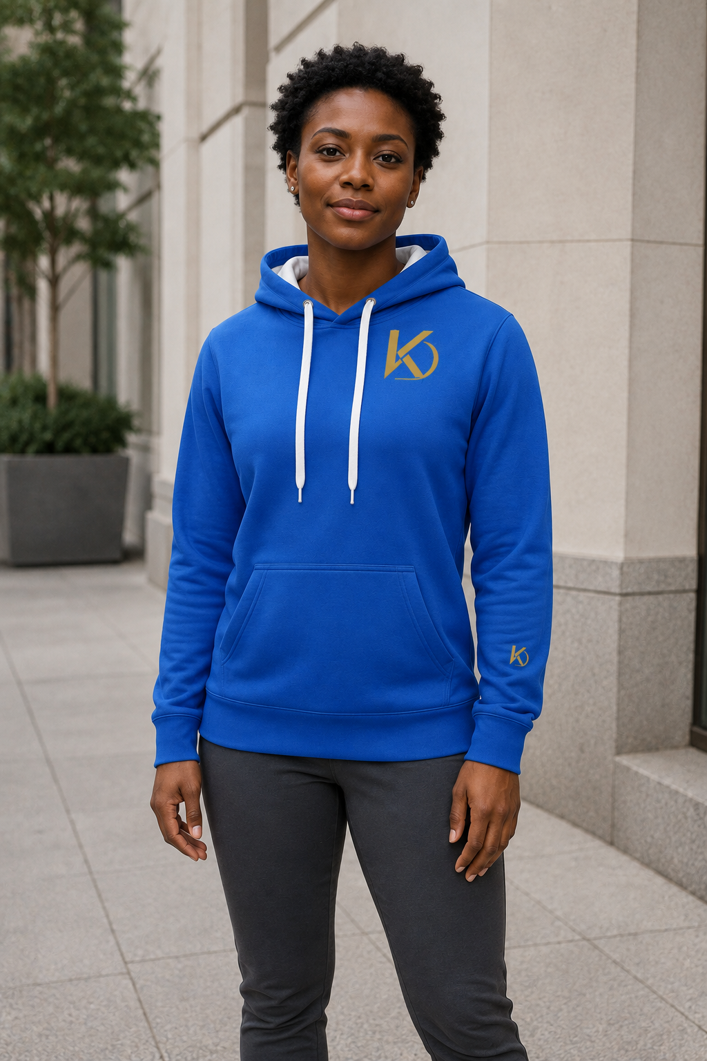 KYNDEO Forge Hoodie - Royal Signature in royal blue, complete front lifestyle view on a female model