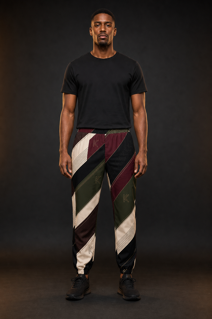 KYNDEO Velocity Track Pant on Black male model, complete front view