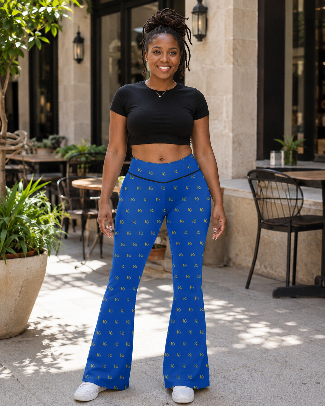 KYNDEO Contour Flare Pant — Royal Monogram — front lifestyle styling view with black thread