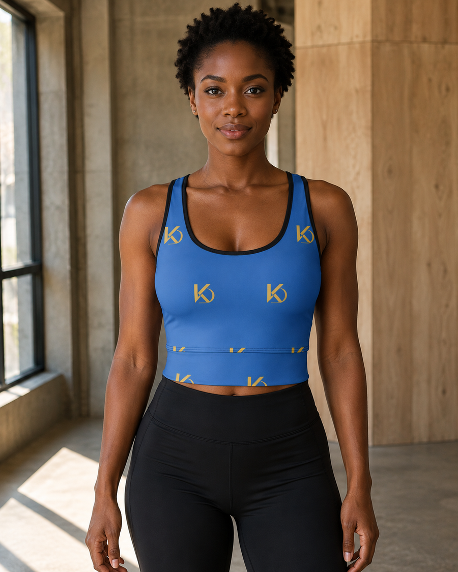 KYNDEO Form Crop Tank — Royal Monogram, royal blue with large gold KD monogram, complete front lifestyle view