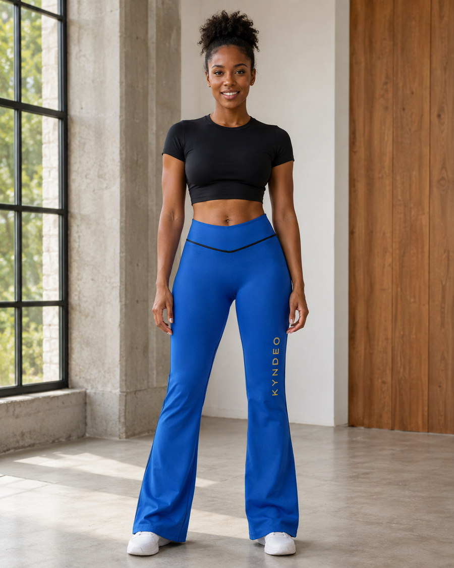 KYNDEO Contour Flare Pant — Royal Signature — full front lifestyle view with black thread