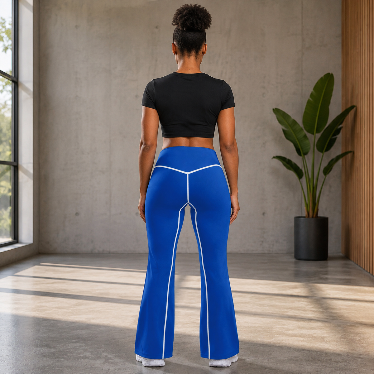 KYNDEO Contour Flare Pant — Royal Signature — full rear lifestyle view with white thread