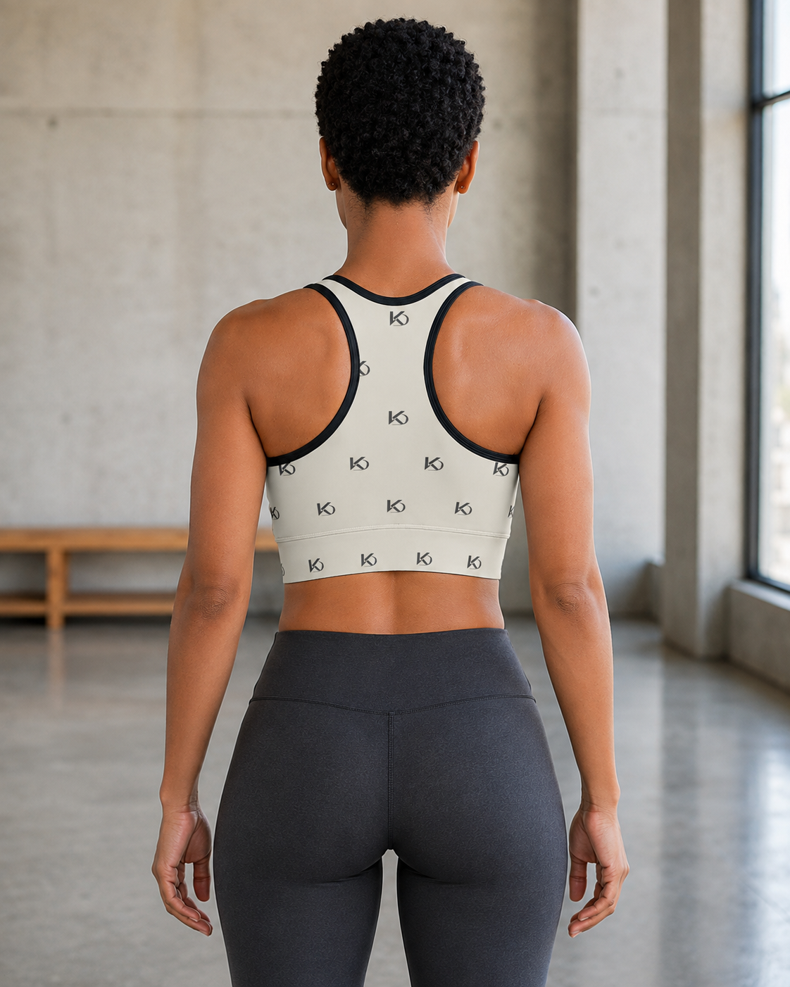 KYNDEO Form Crop Tank — Ivory Monogram, ivory with small charcoal KD monogram, complete rear racerback view