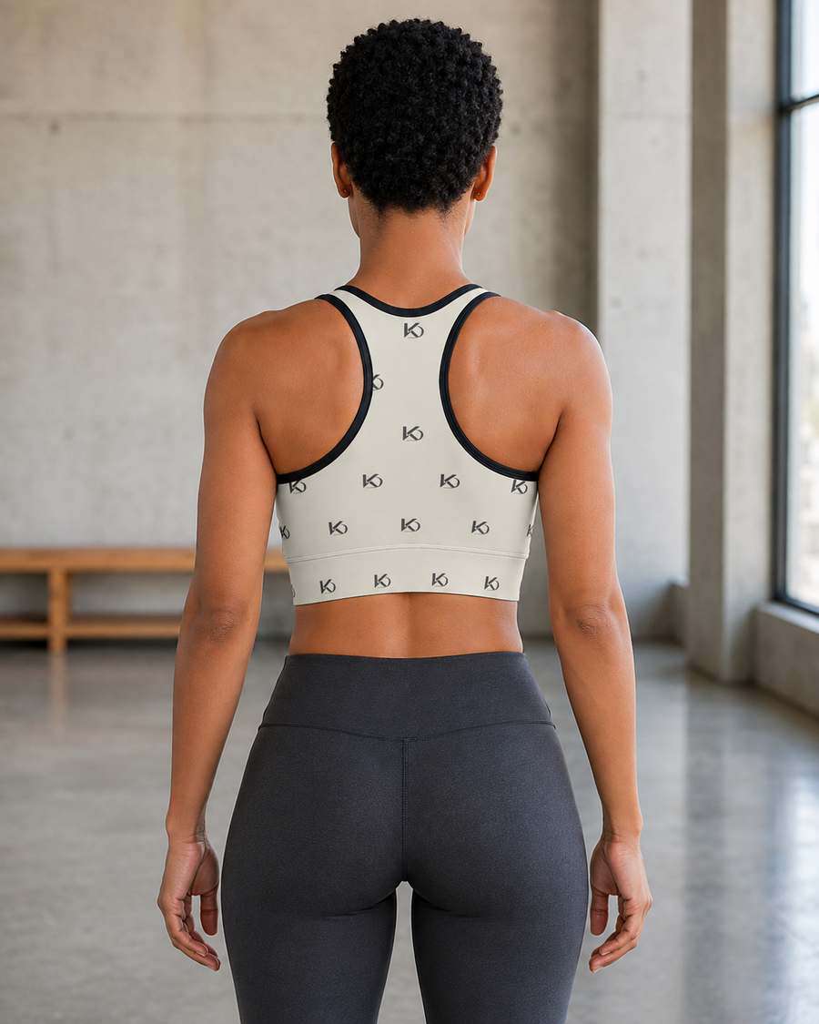 KYNDEO Form Crop Tank — Ivory Monogram, ivory with small charcoal KD monogram, complete rear racerback view